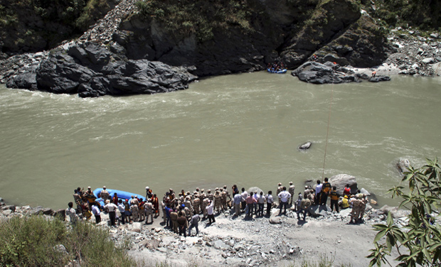 Rescuers continue to search the Beas River for the second day after dozens of students were swept away when a dam released a rush of water without warning near the Larji hydropower station, in Himachal Pradesh (Photo: AP) Rescuers continue to search the Beas River for the second day after dozens of students were swept away when a dam released a rush of water without warning near the Larji hydropower station, in Himachal Pradesh (Photo: AP)